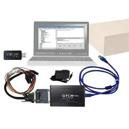 PCM TOOL connected to laptop with USB dongle
